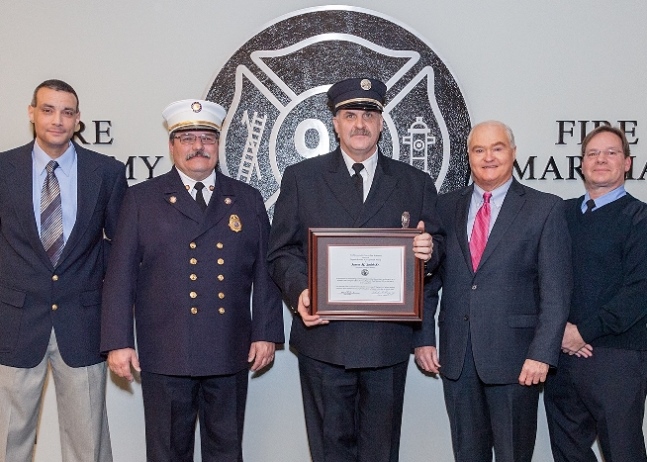 James Smith, Sr. of the Robertsville Fire Company in Marlboro Manalapan is presented with the Class 105 Ronald Fitzpatrick Firefighter 1 Award at the Monmouth County Fire Academy graduation on Jan. 22, 2015 in Howell, NJ. Pictured left to right:  Fire Academy Director Armand Guzzi, Monmouth County Fire Marshal Henry Stryker III, James Smith, Sr., Freeholder John P. Curley and Steve Fitzpatrick.